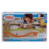 The toy set includes a train and curved track pieces, packaged in a blue box.