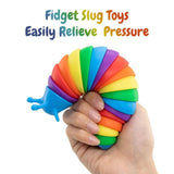 A hand holds a brightly colored, coiled fidget toy made up of multiple segments.