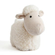 Cream-colored stuffed novelty door stopper shaped like a fluffy sheep with a striped face.