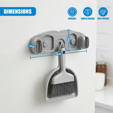 Wall mount displaying two separated slots for cleaning tools and a hanging broom head. Dimensions noted on the fixture.