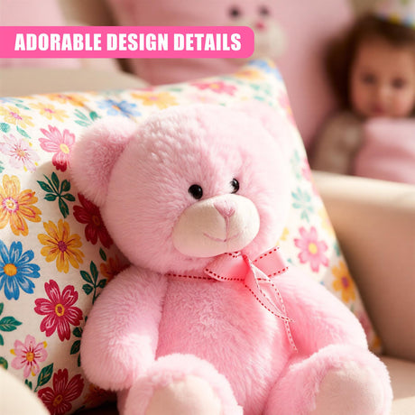 A soft, plush pink teddy bear with a sweet expression, sitting on a colorful floral cushion, surrounded by a child's toys and a child in the background. - UKBuyZone