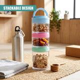 Stackable clear food container holds three visible layers of nuts, dried fruit, and granola.