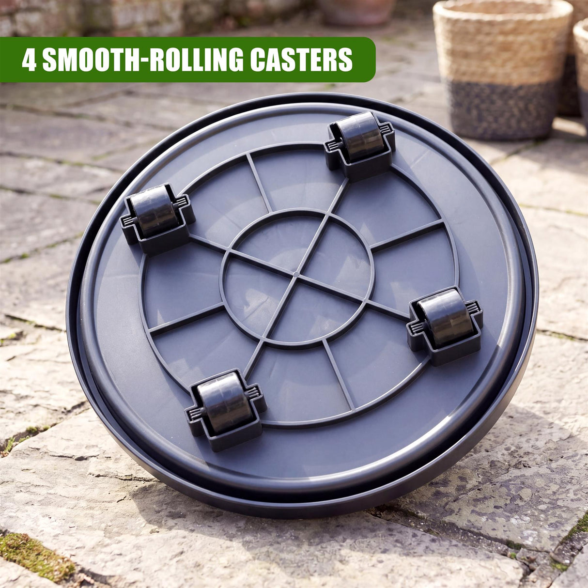 Dark gray, round caddy saucer designed for plants, featuring four attached caster wheels.