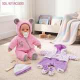 Matching pink and purple plush doll outfits with accessories displayed on a soft, plush rug.