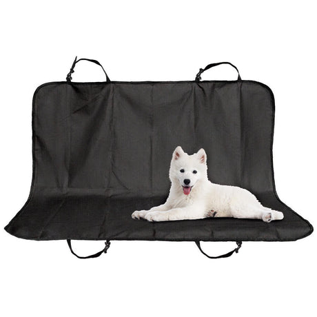 Black dog car seat cover with straps and a light-colored dog lying on it.