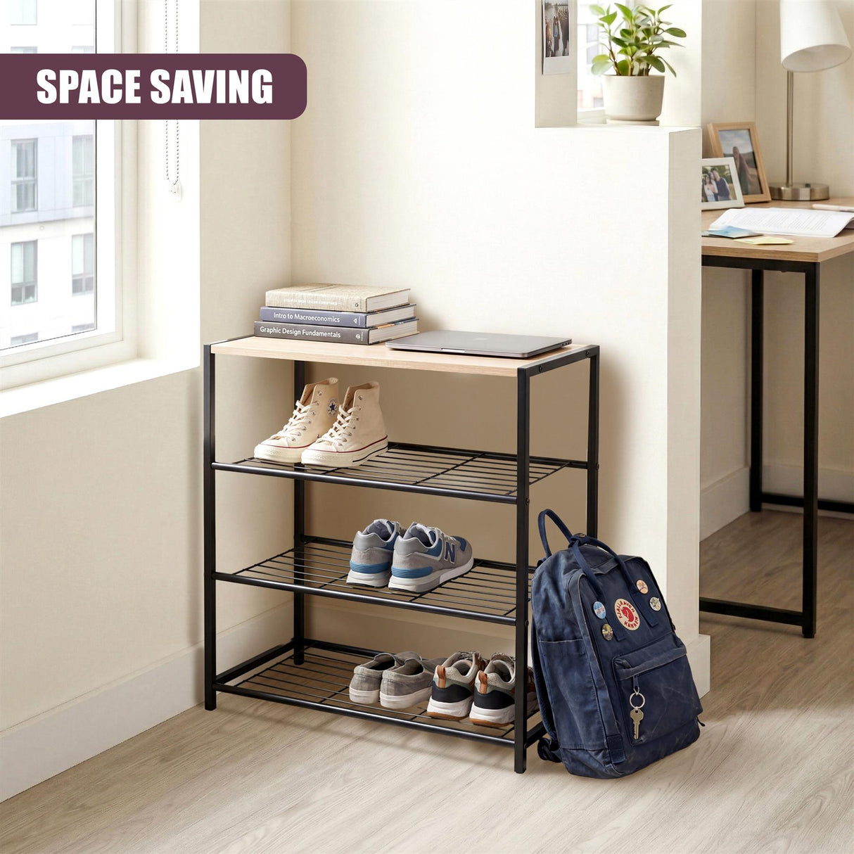 Black metal three-tier shoe rack displaying shoes, with stacked books and a backpack nearby.