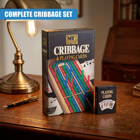 A wooden cribbage board game set in its packaging on a desk next to a lamp and pen