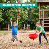 Two children play on a swing set at a playground, using the trapeze and swing seat.