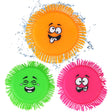 Four brightly colored flying disc toys with funny faces on the shop 'ukbuyzone'.