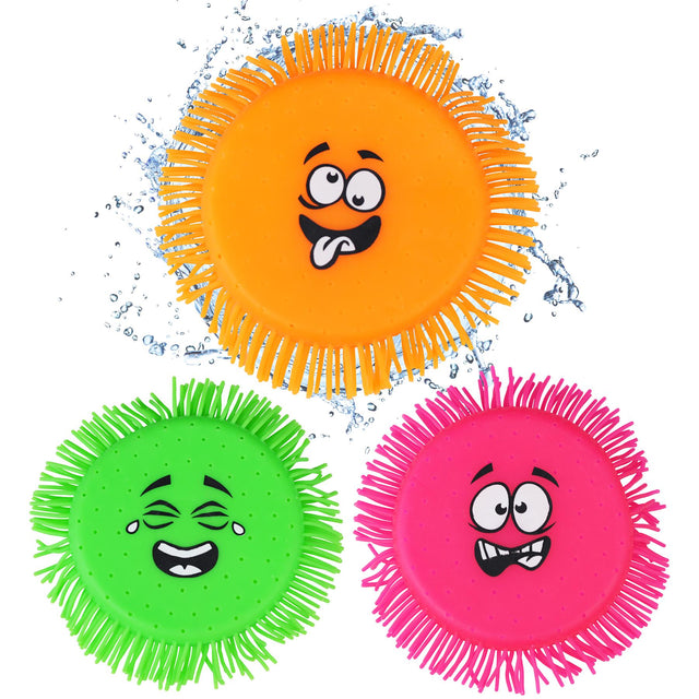 Four brightly colored flying disc toys with funny faces on the shop 'ukbuyzone'.