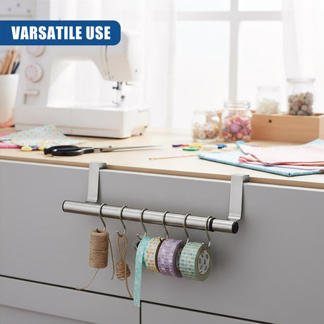 Metal rail accessory holding multiple spools of thread and various colored crafting ribbons.