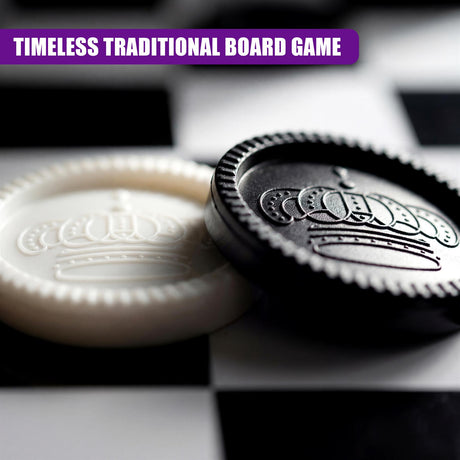 A black circular game container and a light piece featuring an engraved crown rest on a board.