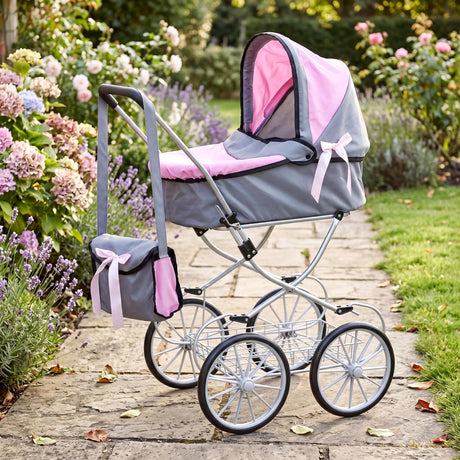 Doll stroller features a grey and pink fabric canopy, attached matching bag, and metal wheel frame.