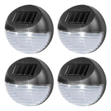 Four exterior solar lights featuring a black body, solar panel, and white LED emitter.