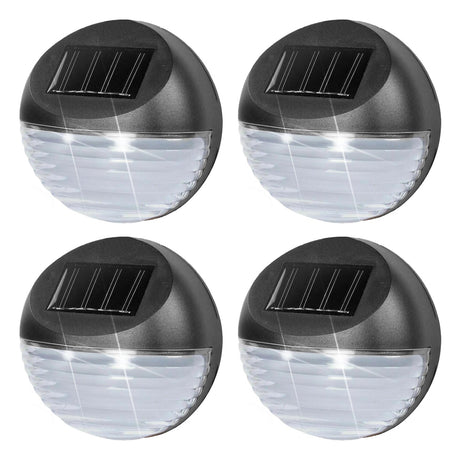 Four exterior solar lights featuring a black body, solar panel, and white LED emitter.