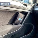 Black fabric pouch with white lettering rests inside the storage compartment of a car console.