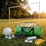 Green carry bag for 2-in-1 badminton and volleyball set on grass with rackets, shuttlecocks, ball, pump, pegs and net poles