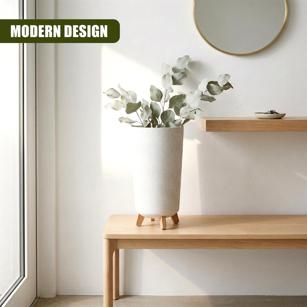 Tall, cylindrical flower pot with small wooden legs holding green leafy branches on a wooden surface.