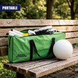 A green portable badminton and volleyball set on a wooden bench with a white ball beside it