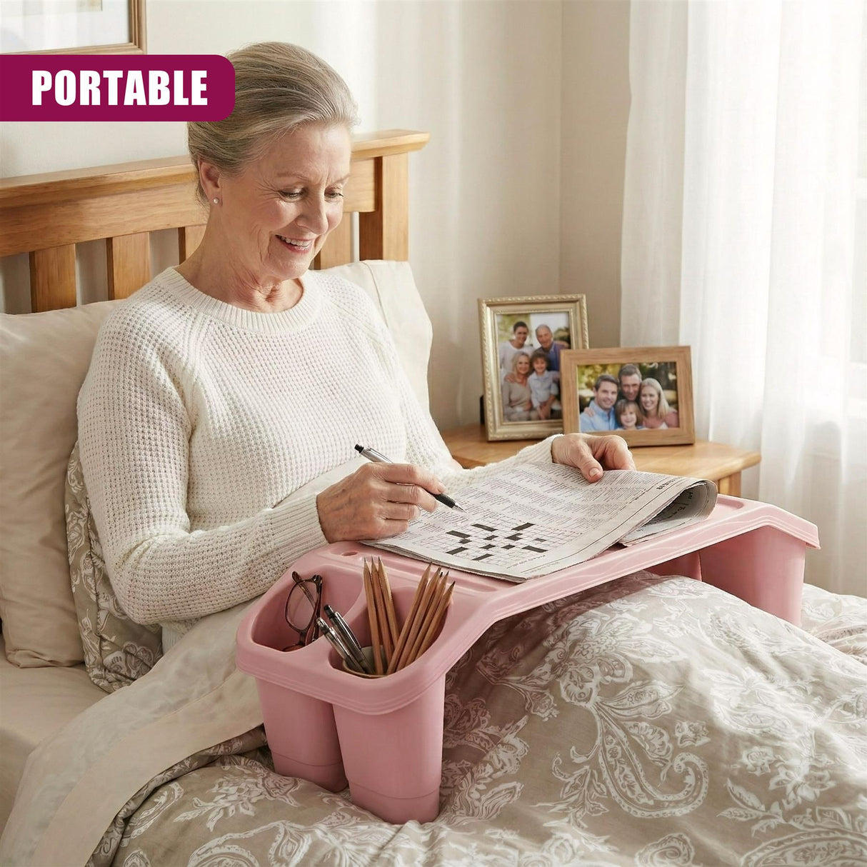 A woman sitting in bed, a pink tray with compartments on her lap, and a mobile phone on top of it. - UKBuyZone