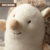 Plush toy hedgehog door stopper featuring a light brown snout and soft, textured fabric.