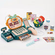 A toy cash register with a display screen, keyboard, and coin tray, surrounded by play money, food, and a toy shopping basket. - UKBuyZone
