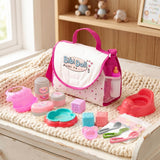 Pink and white changing bag surrounded by doll play accessories, basins, bottles, and feeding toys.