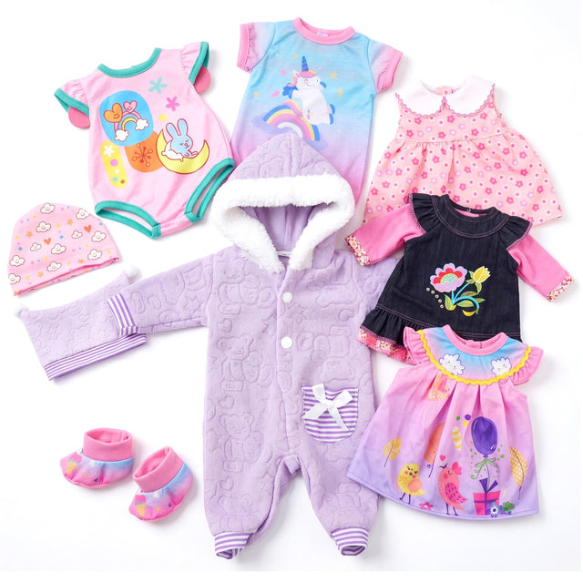 Six doll clothing pieces featuring jumpsuits, dresses, tops, and accessories in pink and lavender colors.