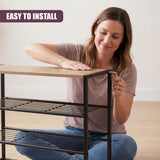 Woman sitting on a black metal three-tiered shoe rack with wooden seating surface.