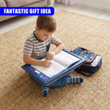 Child writing at a portable blue lap tray positioned on a cushion and rug.