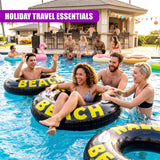Large black inflatable rings with yellow lettering float in the blue pool water.