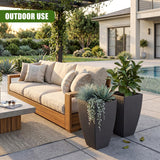 Tall, dark gray rectangular planter pot holding various leafy plants and succulents outdoors.