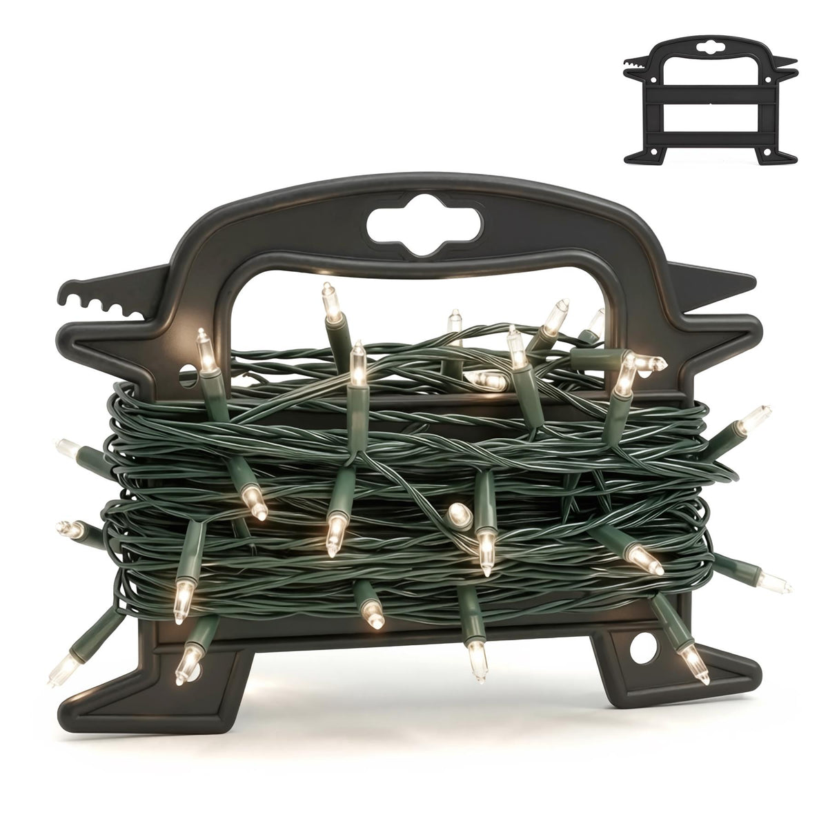 A black plastic Christmas light reel storage holder with a tangled green string of lit fairy lights coiled inside it