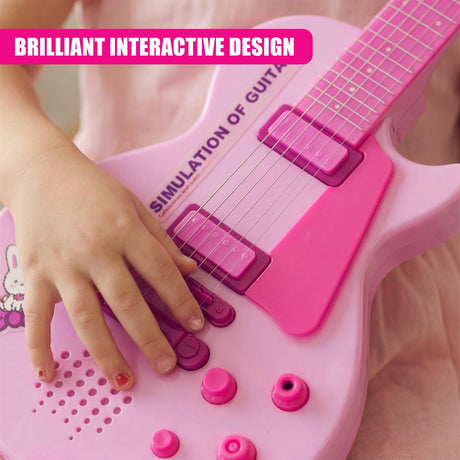 Child's hands interact with the pink toy guitar playset, touching the strings and controls.
