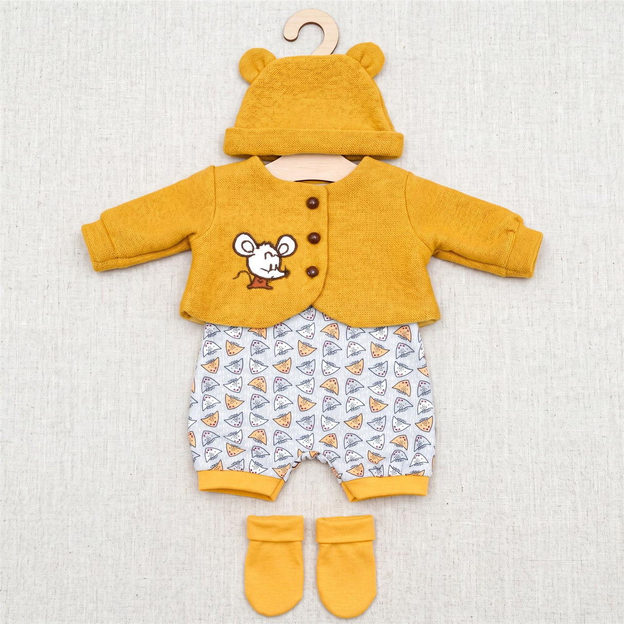 Yellow doll clothing set featuring a mouse-themed top, patterned pants, and matching socks.