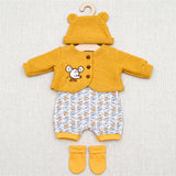 Yellow doll clothing set featuring a mouse-themed top, patterned pants, and matching socks.