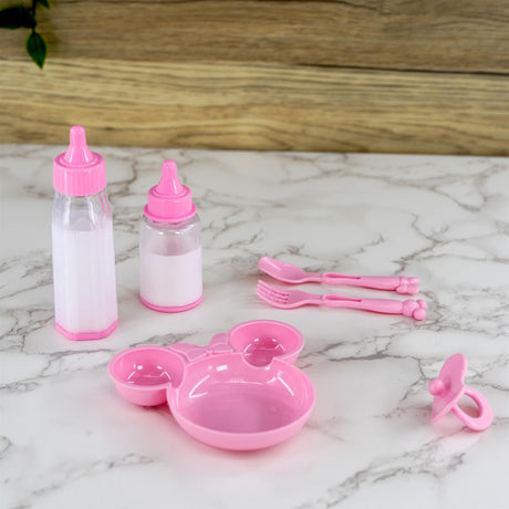 Pink toy feeding set including bottles, bowl, and utensils for role play.