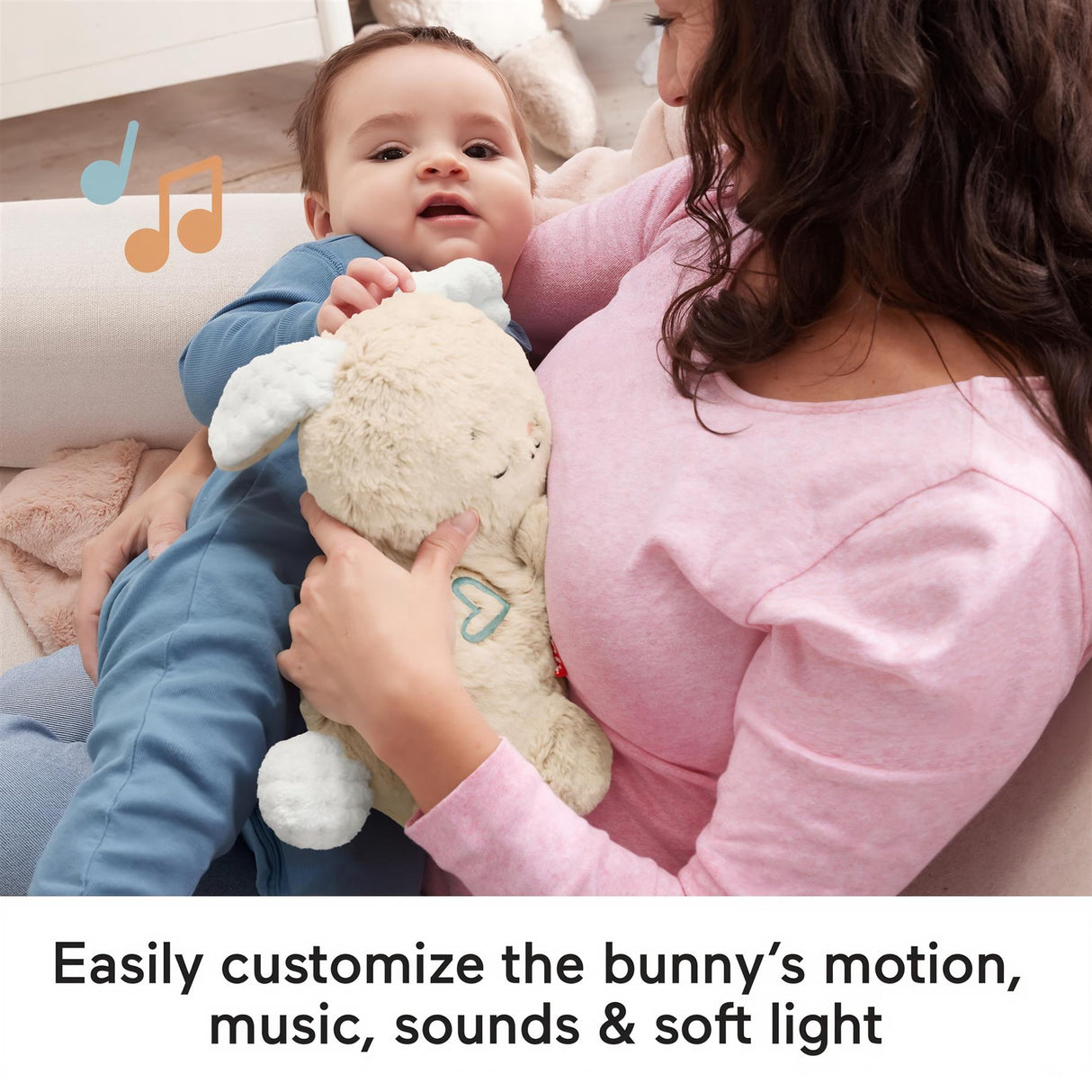 Woman holding a baby who cradles a plush, light-colored bunny toy accessory.