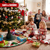 A family opening presents around a Christmas tree with an adjustable green GEEZY tree stand holding it