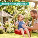 Family swinging on a red garden swing set surrounded by flowers and greenery.