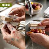 A person uses a wooden nail brush to scrub nails and skin, then rinses the brush under running water.