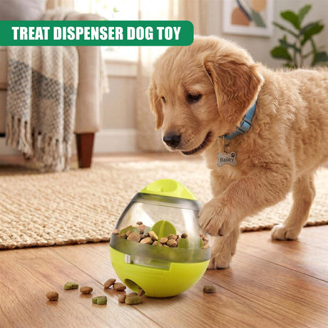 Golden retriever puppy near a yellow treat dispenser dog toy with scattered treats.