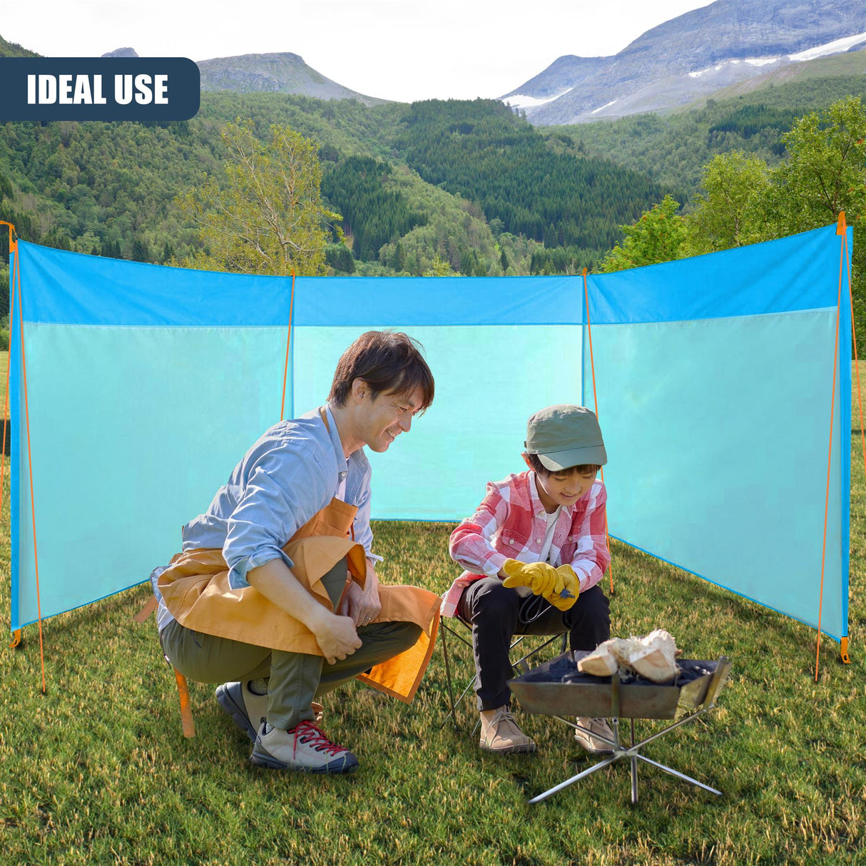 A man and child sit outside near a portable blue fabric privacy screen enclosure.