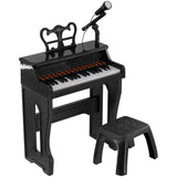 Small black piano keyboard with stool, ideal for children learning to play. - UKBuyZone