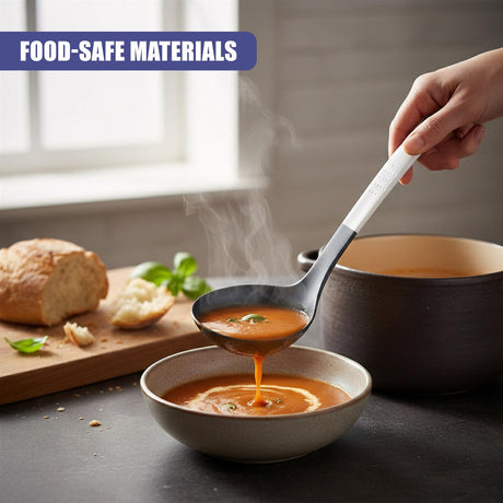 A hand dips a metal spoon into orange soup in a shallow ceramic bowl on a dark surface.