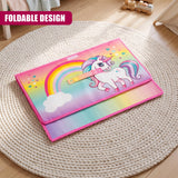 Rainbow Unicorn Storage Box from The Magic Toy Shop lies folded on a round beige rug