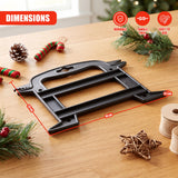 Black Christmas light reel storage on a wooden table surrounded by festive decorations