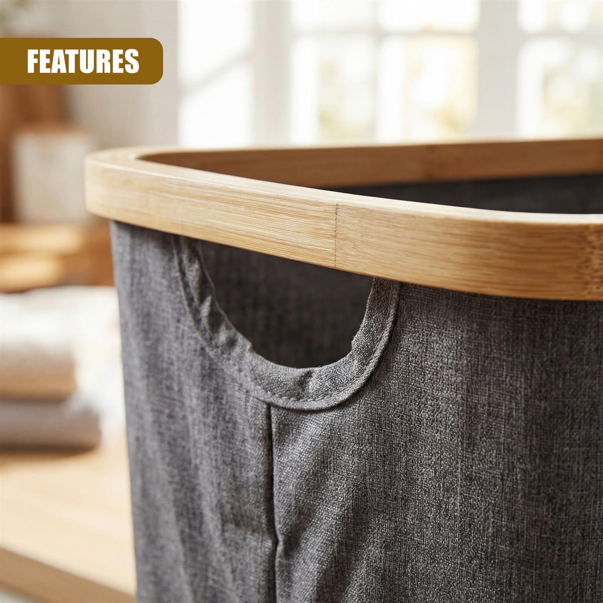 Grey fabric laundry hamper with a natural wood rim and a visible fabric opening.