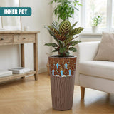 Tall, textured mocha brown pot featuring blue arrows, holding a potted green houseplant.