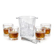 Four whiskey glasses containing amber liquor surround a clear ice bucket and metal scoop.